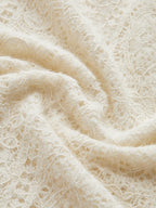 Cream knit top with openwork pattern texture close-up
