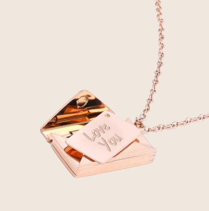 Rose gold envelope locket necklace open view with 'Love You' tag
