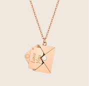 Rose gold envelope locket necklace front view with 'Love You' tag
