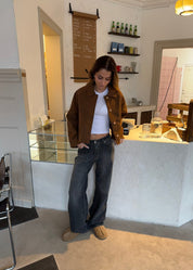 Cropped silhouette jacket brown front view with hands in pockets