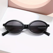 Sunglasses, retro oval frame, black plastic, front view