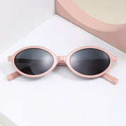 Sunglasses, retro oval frame, pastel pink plastic, front view