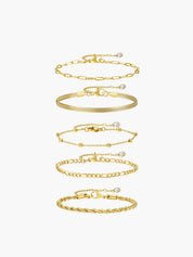 Gold armband set with different chain styles arranged vertically