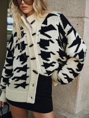 Women's cardigan with black and white houndstooth pattern, close-up front view