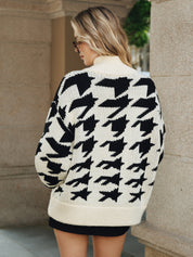 Women's cardigan with black and white houndstooth pattern, back view