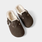 Dark brown suede clogs with fur lining side view