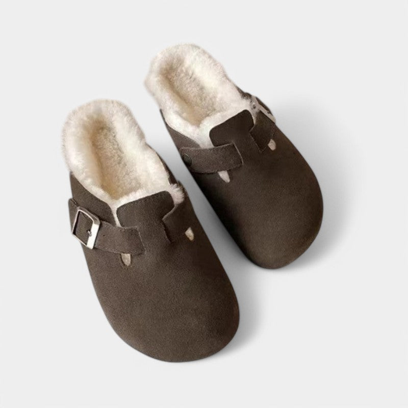 Dark brown suede clogs with fur lining side view
