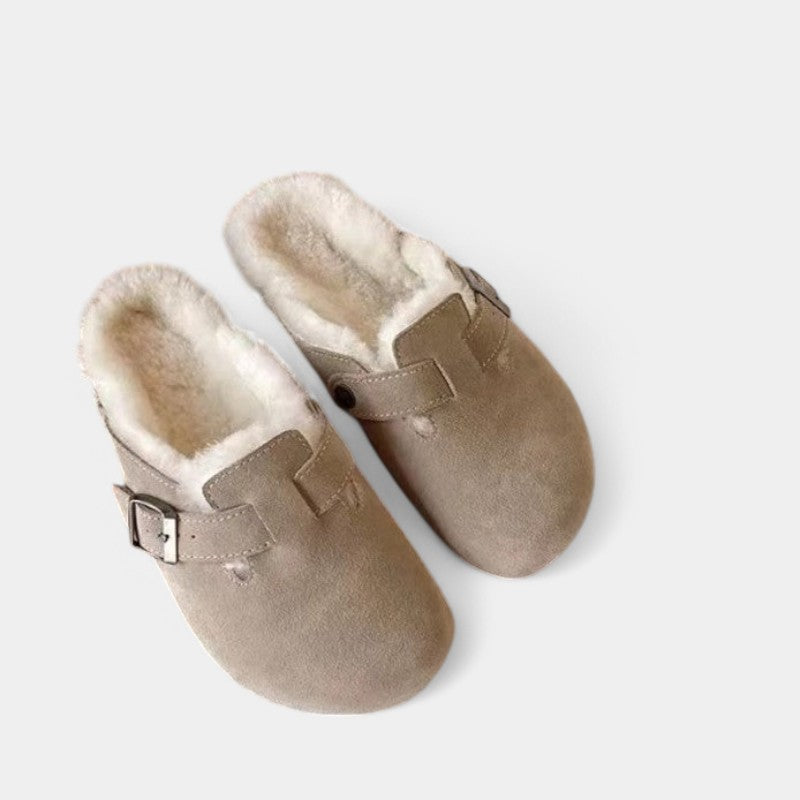 Beige suede clogs with fur lining close-up