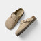 Beige suede clogs with buckle front view