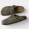 Gray suede clogs with buckle front view