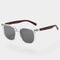 Sunglasses with brown wooden arms and transparent frames front view