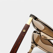 Sunglasses hinge detail with brown wooden arms and gold accents