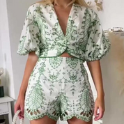 Two-piece set with green leaf pattern worn by model, side view