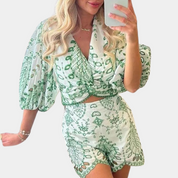 Two-piece set with green leaf pattern worn by model, front view
