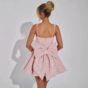 Mini jurk roze met strik op rug achterzijde