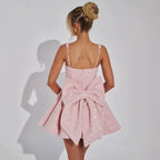 Mini jurk roze met strik op rug achterzijde