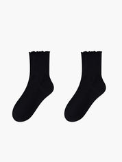 Black ruffled ankle socks flat lay side view