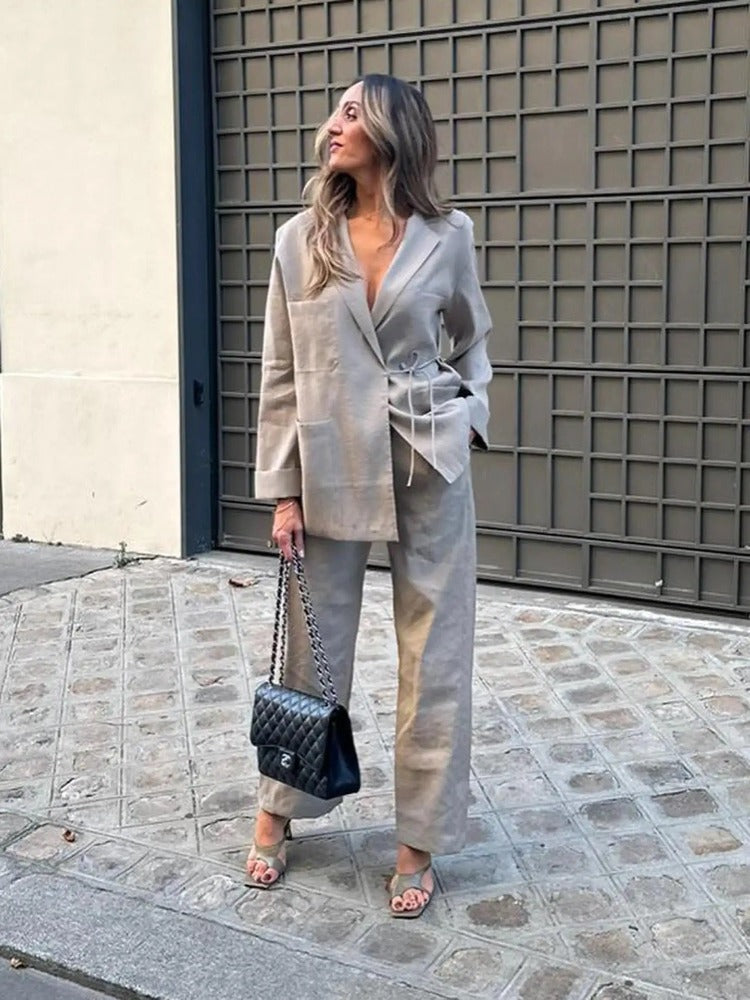 Tweed suit beige front view with black bag and beige heels