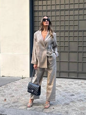 Tweed suit beige side view with black bag and beige heels