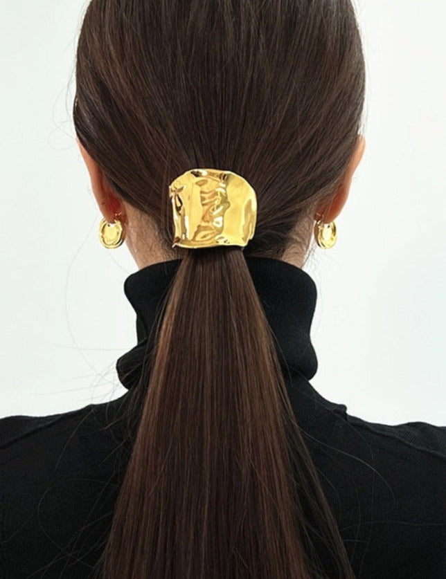 Gold hair cuff with organic texture, worn on ponytail, back view