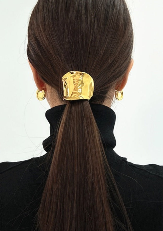 Gold hair cuff with organic texture, worn on ponytail, back view