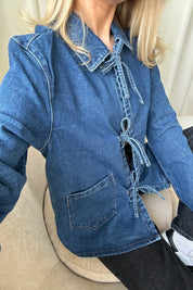 Close-up of denim jacket tie front detail