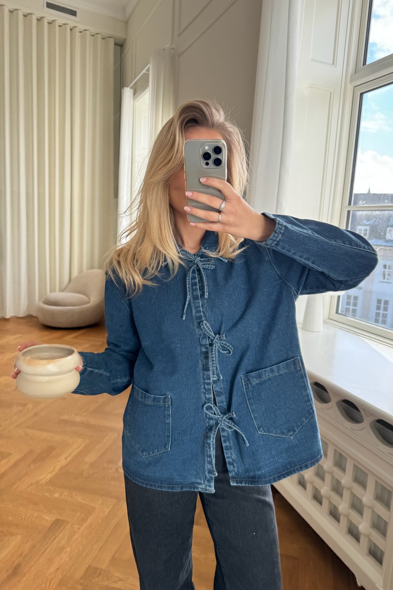 Denim jacket with tie front detail worn with jeans