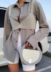 Pearl grid bralette worn with blazer and shorts close-up view