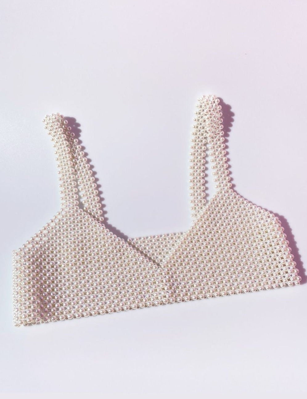 Synthetic pearl bralette close-up side view