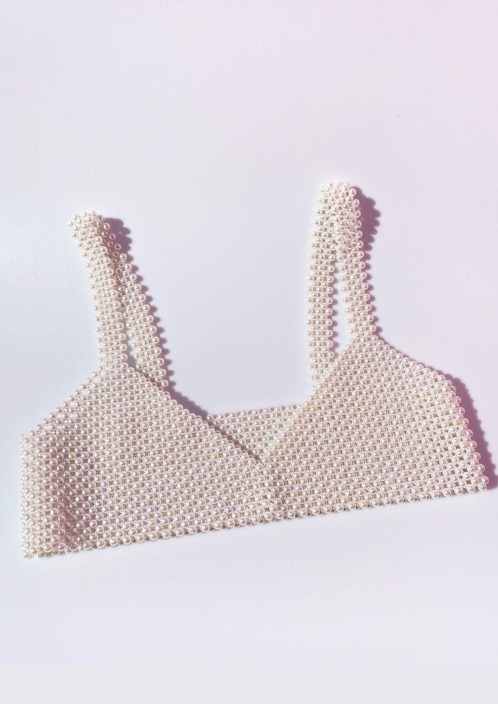 Synthetic pearl bralette close-up side view