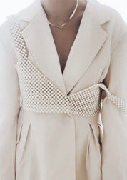 Pearl grid bralette worn under white blazer front view