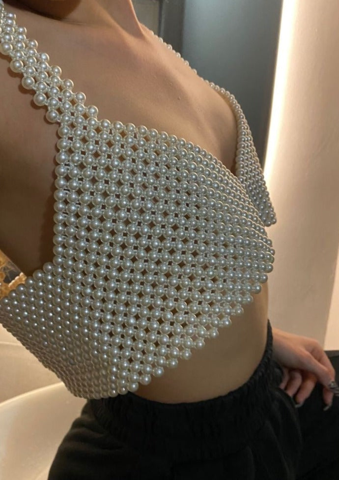 Bralette with woven pearl grid detail worn with black pants side view
