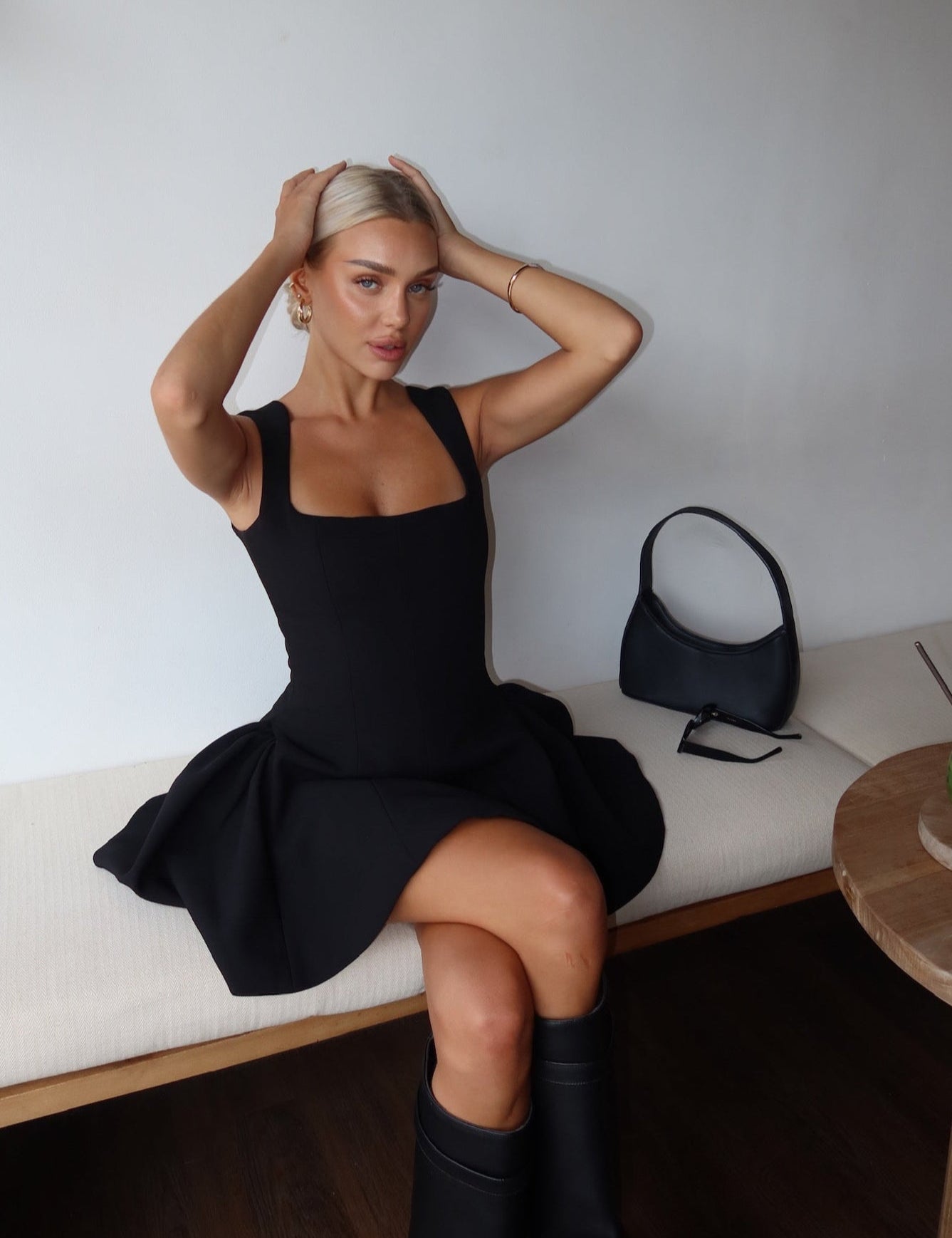 Black dress with structured flared skirt side view