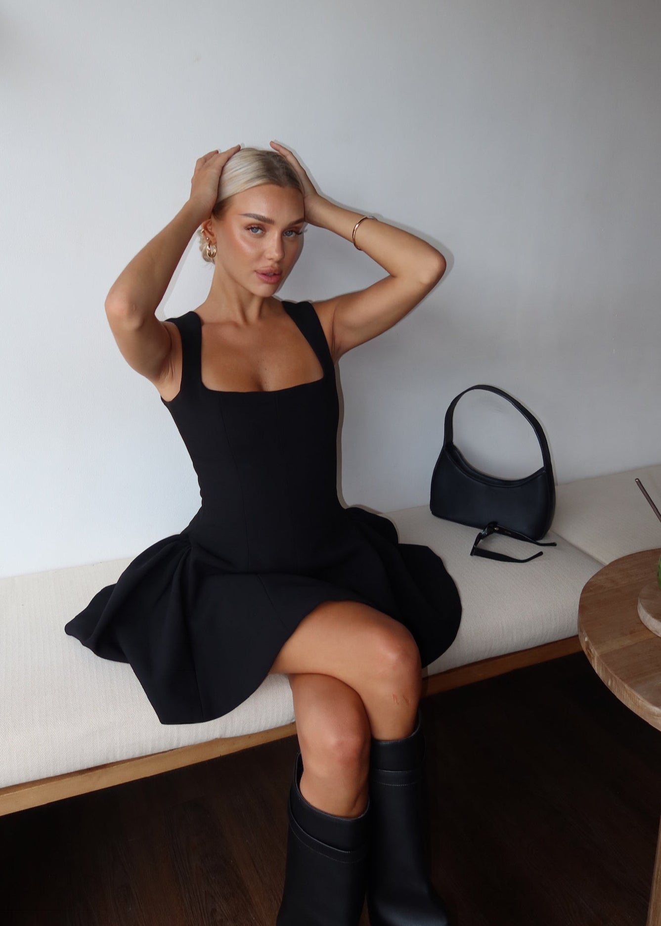 Black dress with structured flared skirt side view