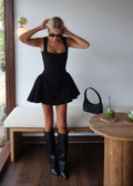 Black dress with structured flared skirt front view