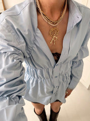 Blouse with ruched detailing and puff sleeves, side view