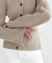 Knit vest beige with bell sleeves and brown buttons front view
