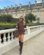 Brown blazer and skirt set with knee-high boots front view