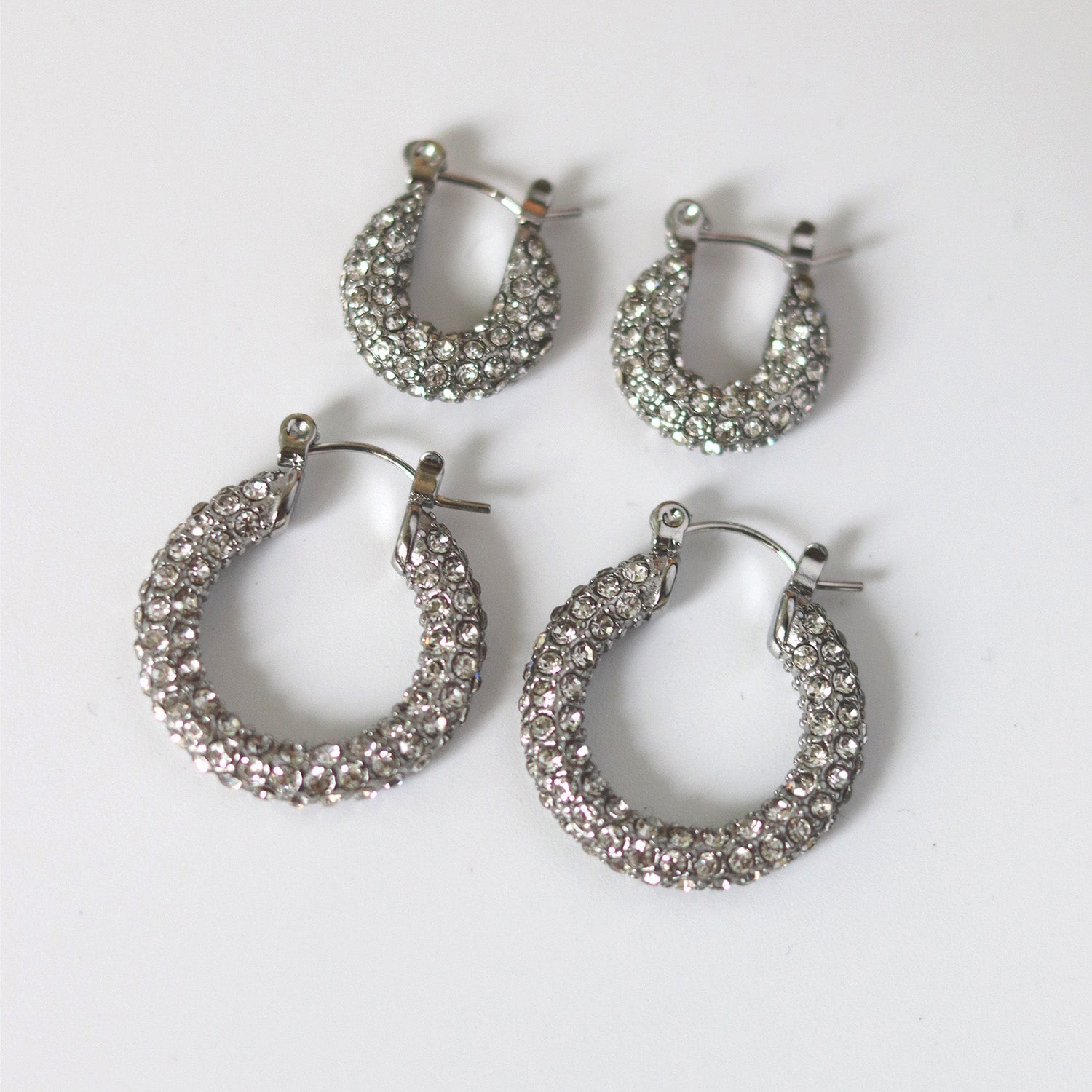 Silver hoop earrings with pave crystals angled view