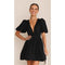 Black dress with deep V-neck and puffed sleeves front view