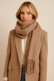 Caramel scarf with fringe wrapped around neck front view