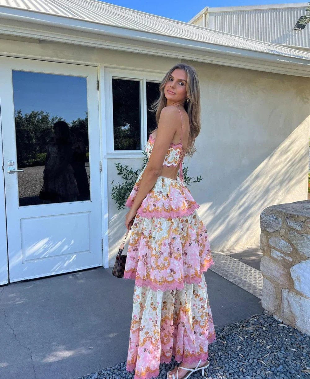 Maxi dress with floral design and lace details, pink trim, three-quarter view