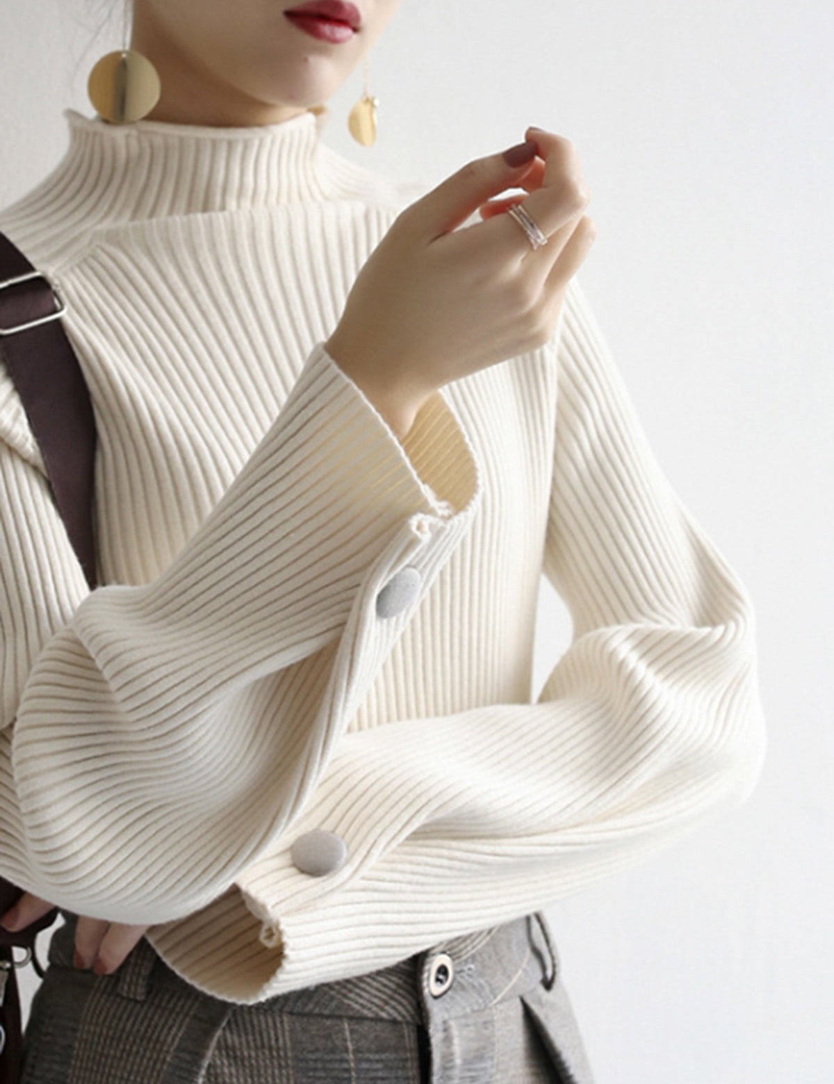Cream sweater with balloon sleeves and ribbed texture, front view