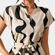 Abstract print dress black and beige close-up torso