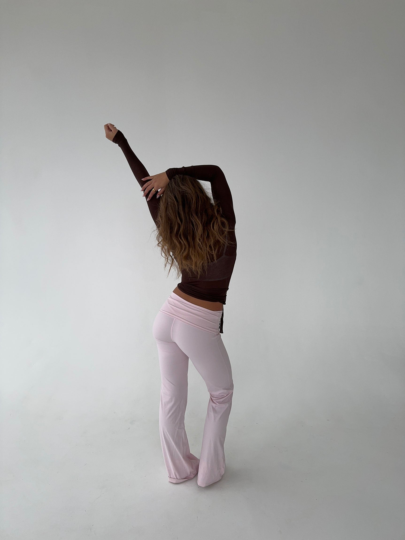 Brown wrap top with pink pants back pose