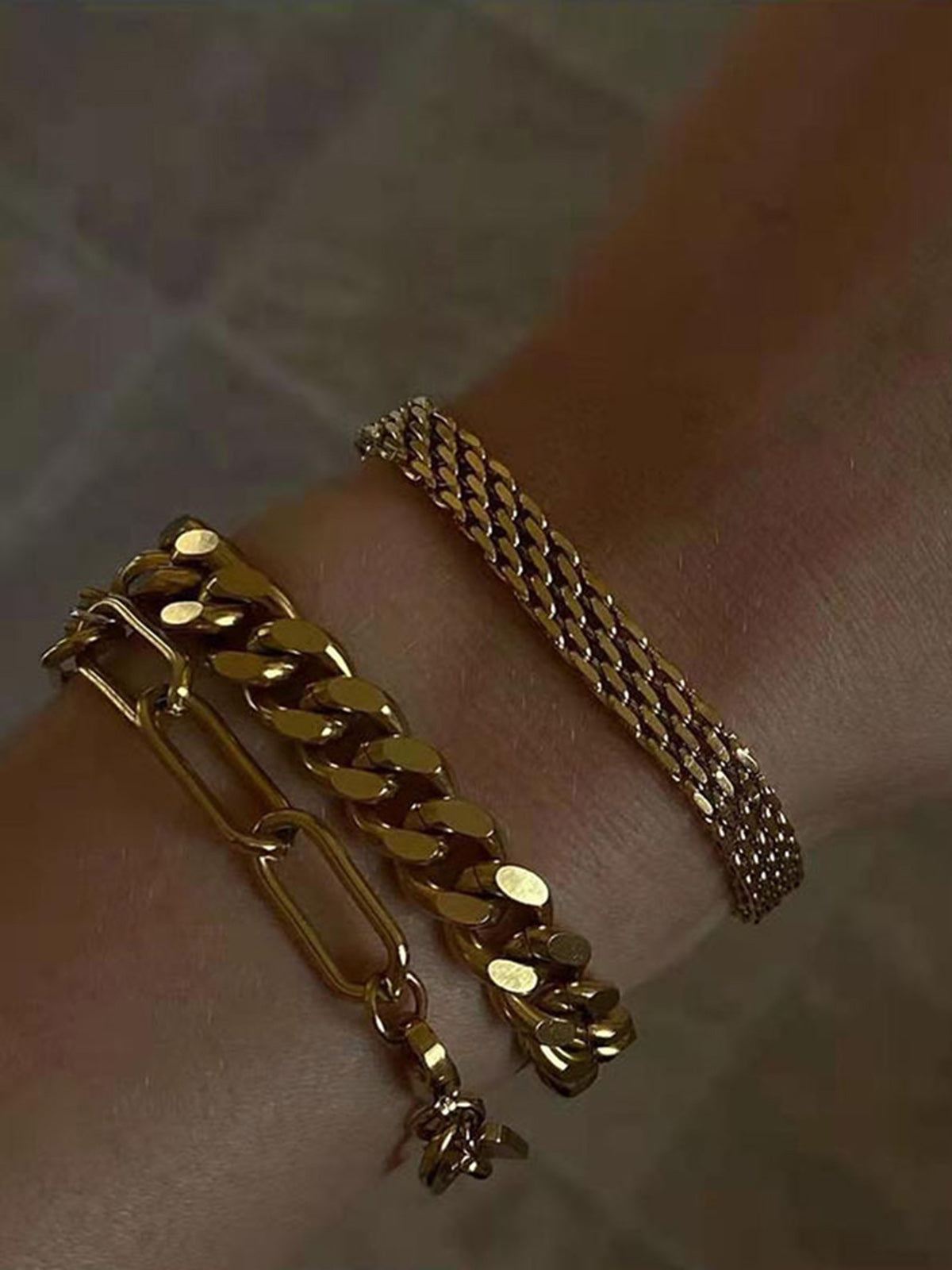 Gold multi-strand woven bracelet with clasp detail side view