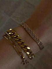 Gold multi-strand woven bracelet with clasp detail side view