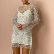 Sequined mini dress with mesh overlay close-up
