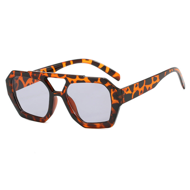 Geometric sunglasses yellow-brown front view isolated
