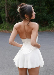 Beige corset dress outdoor back view